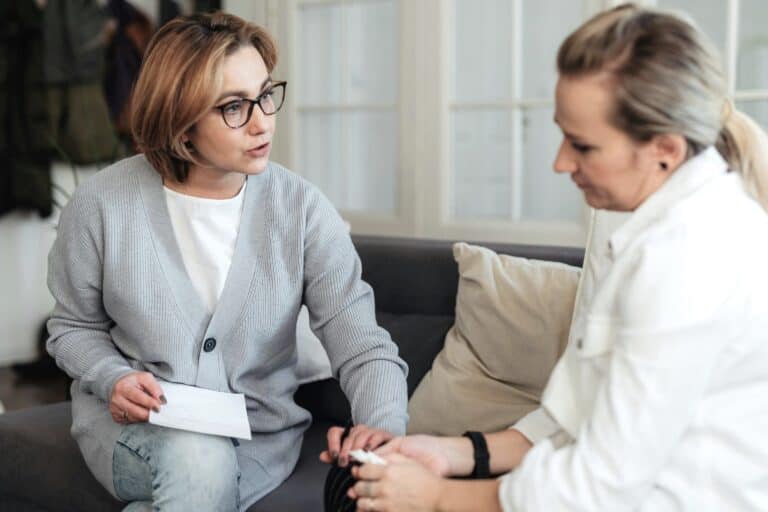 Woman avoiding professional support due to desiring personal independence and guilt for needing support, thanks to Withheld Worries.