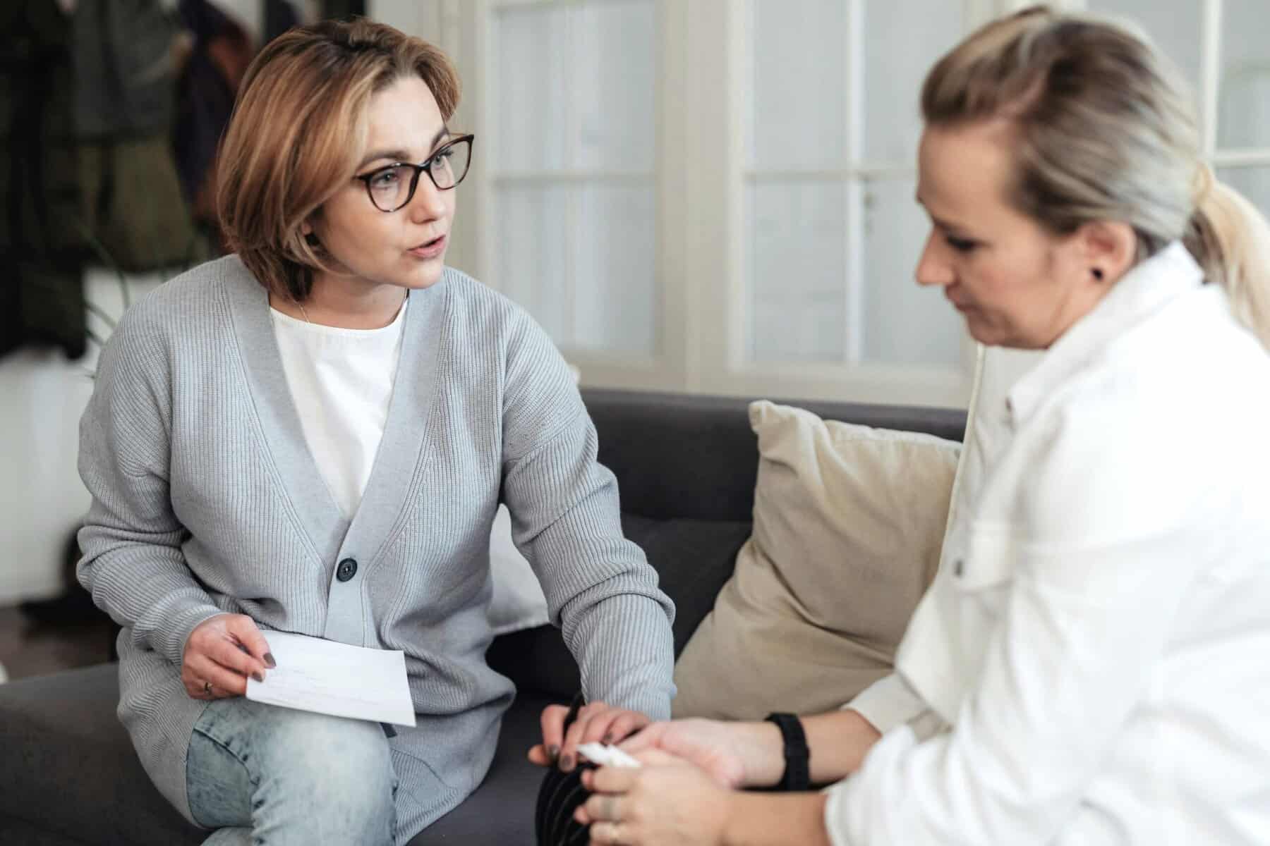 Woman avoiding professional support due to desiring personal independence and guilt for needing support, thanks to Withheld Worries.