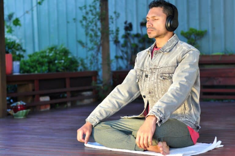 Man practising mindful breathing outdoors, showing real daily regulation beyond common misinterpretations through Emotional Monitoring.