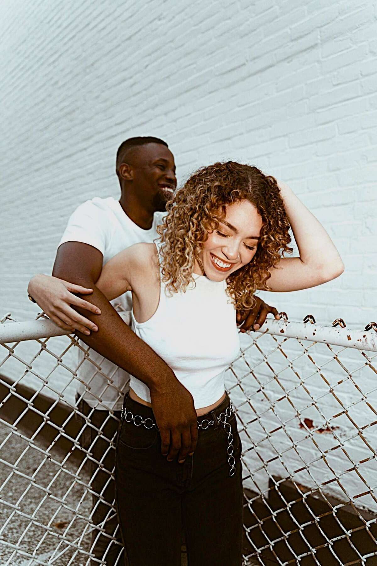 Couple sharing affection, illustrating difference between feeling loved and being loved within the study of Love Perception Psychology.