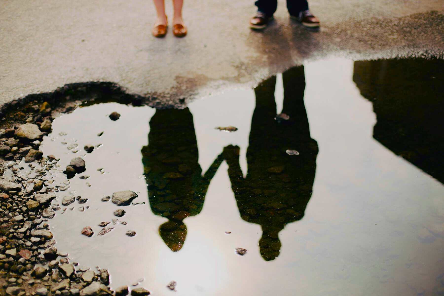 Two people reflected in water, showing self-worth and relationships with others after Defining Boundaries.