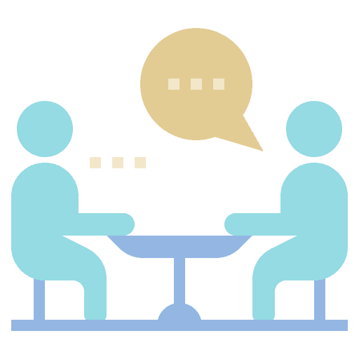 Two individuals engaged in a counselling session, discussing mental health topics in a professional setting.